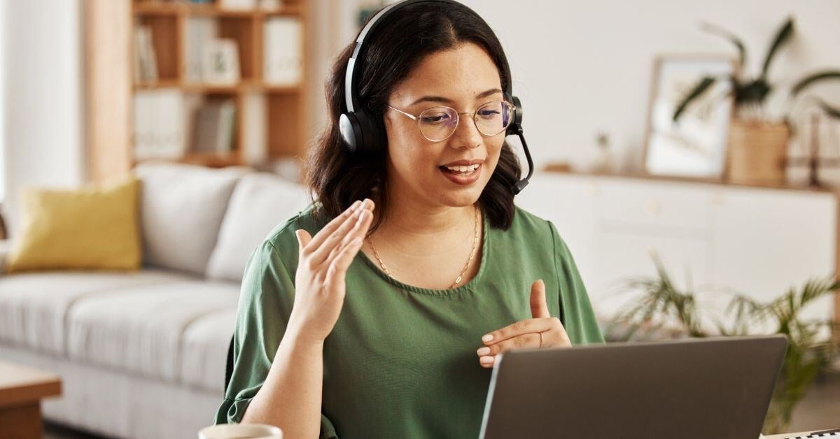 Competent and educated customer service agent talks a customer through the steps of her service in the comfort of her own home