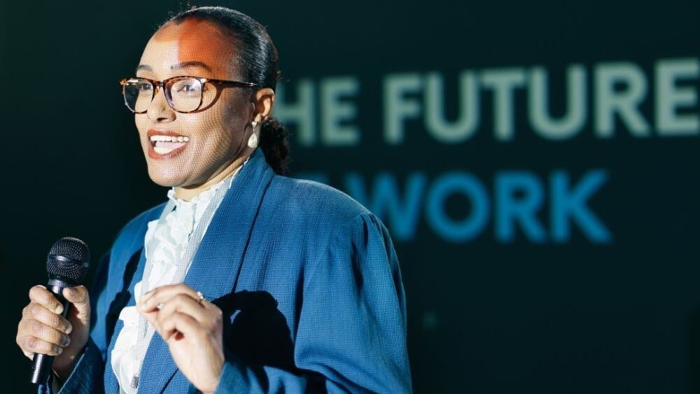 Educated recruiter speaks at a conference about the future of work