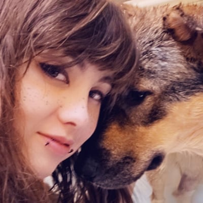 Portrait of Bethany C and her dog Hades