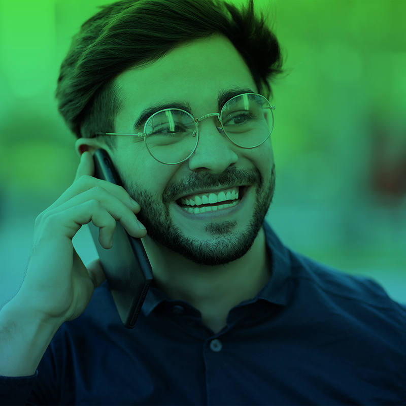 young-man-talking-on-the-phone-outdoors-2023-11-27-05-13-57-utc copy-1